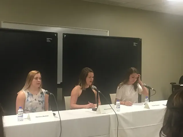 Students practicing a media interview on a panel