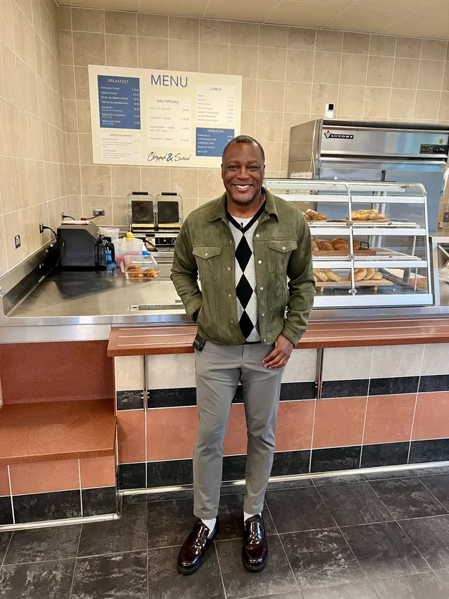 Kevin King standing in front of a cafe counter