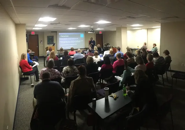 Audience watching a workshop presentation